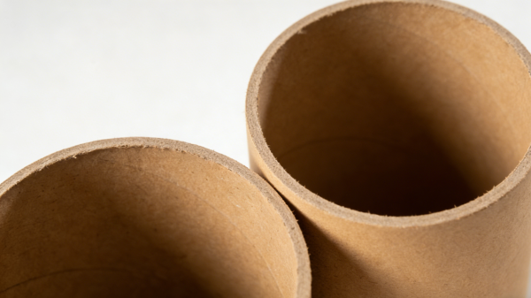 Structure detail of custom paper tube packaging showing thick wound paperboard layers